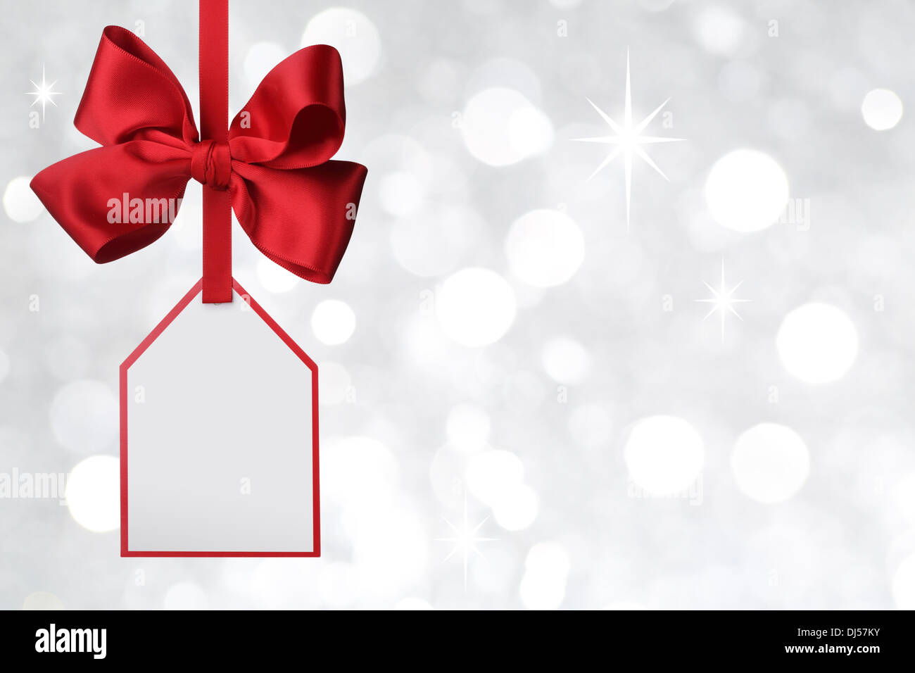 Bow with tag on abstract background Stock Photo