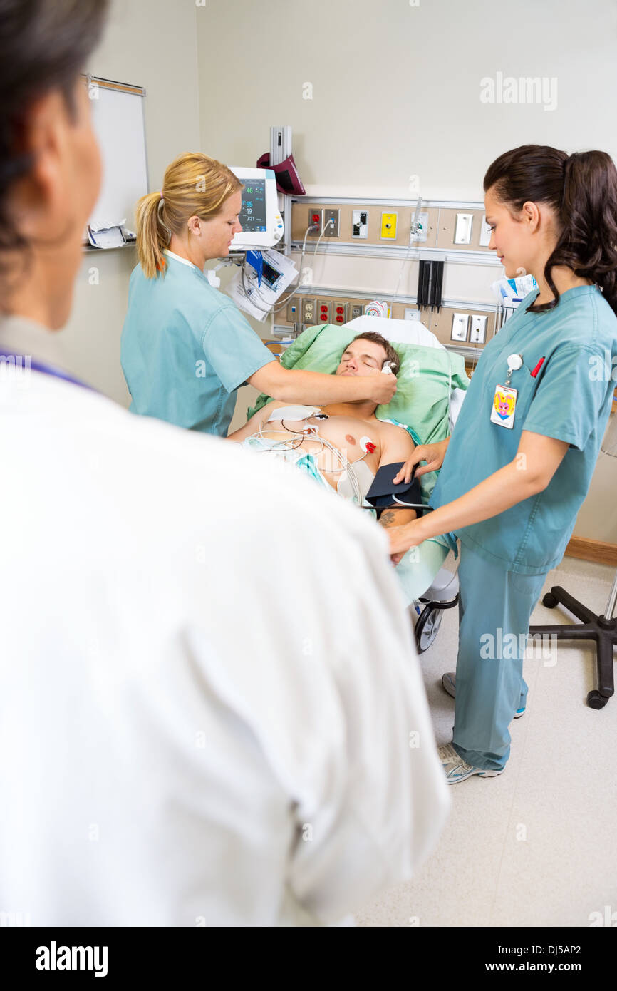 Nurses And Doctor Treating Critical Patient Stock Photo Alamy