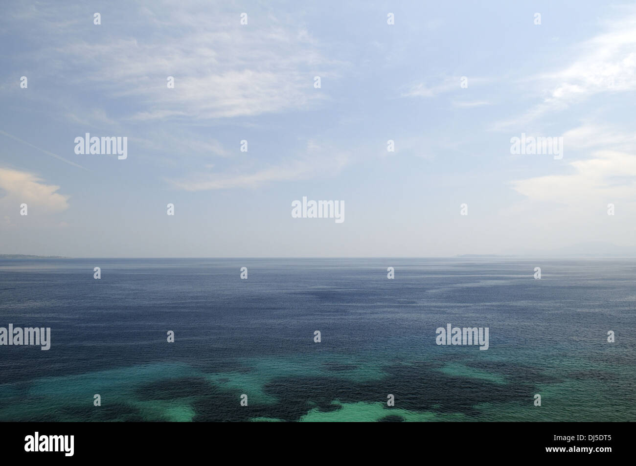 ocean with blue sky and white clouds Stock Photo - Alamy
