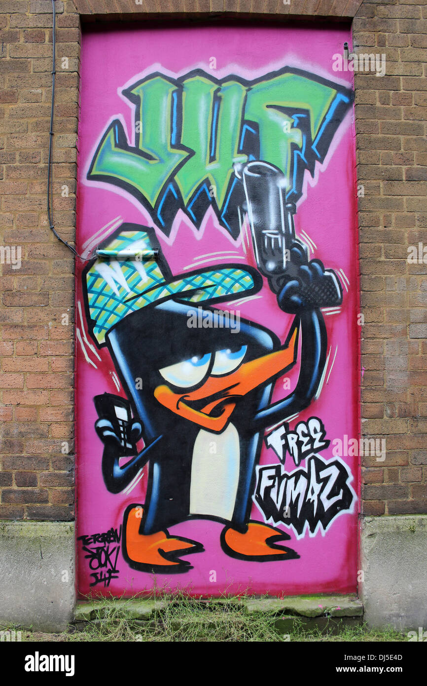 Penguin Urban Graffiti by Artist Stok, Liverpool, Merseyside, UK Stock Photo
