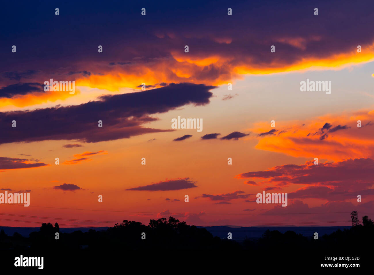 Beautiful Sunset With Colorful Orange, Yellow and Purple Clouds Stock Photo