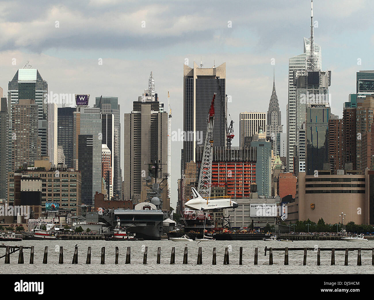 The NASA space shuttle prototype Enterprise is lowered by crane into