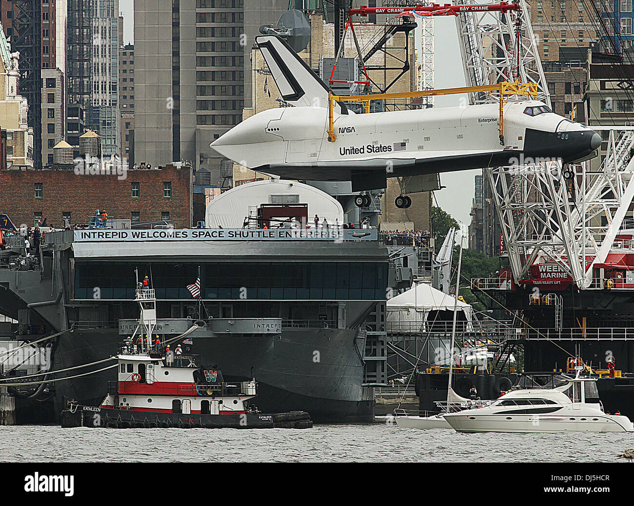 The NASA space shuttle prototype Enterprise is lowered by crane into ...