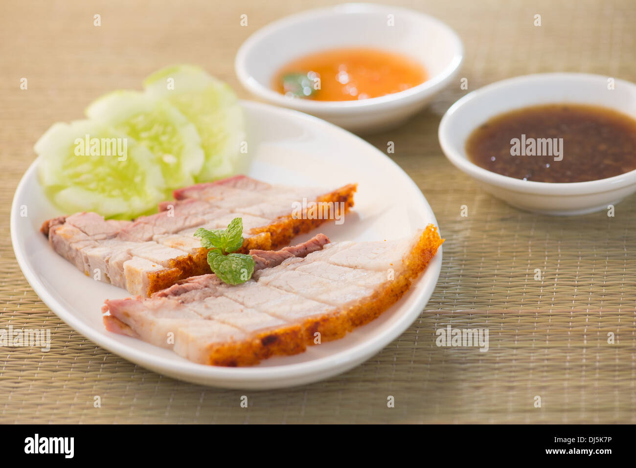 Siu Yuk - Chinese roasted pork served with soy and hoisin sauce. Stock Photo