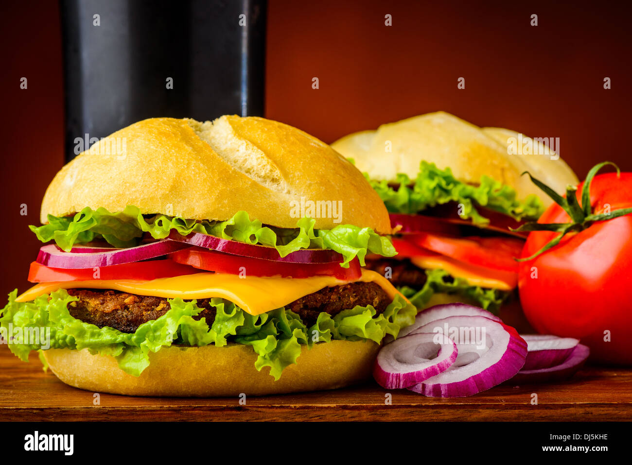 still life with traditional american cheeseburger and onion rings Stock Photo