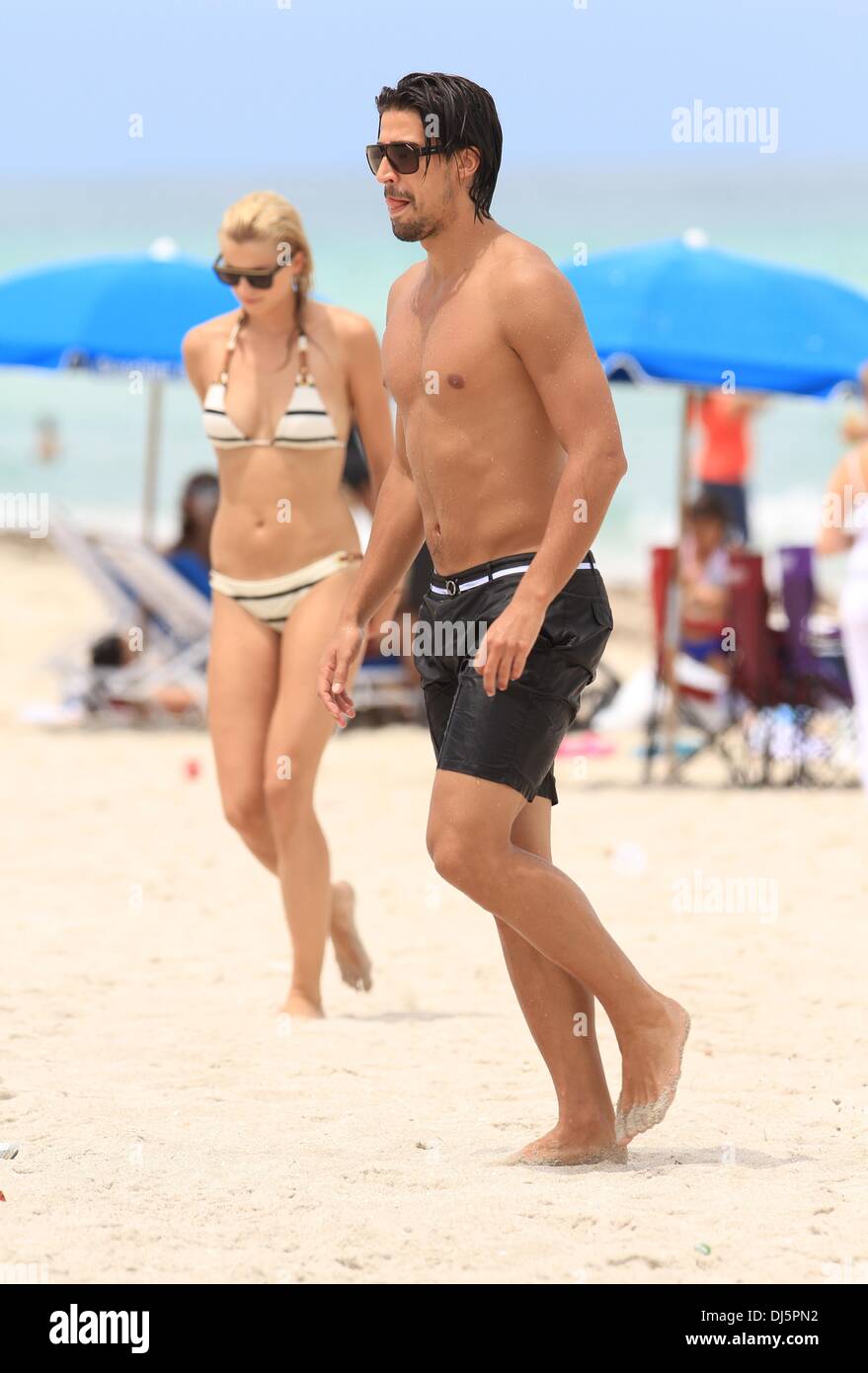 Sami Khedira and Lena Gercke on the beach in Miami. Miami, Florida -  11.07.2012 Stock Photo - Alamy