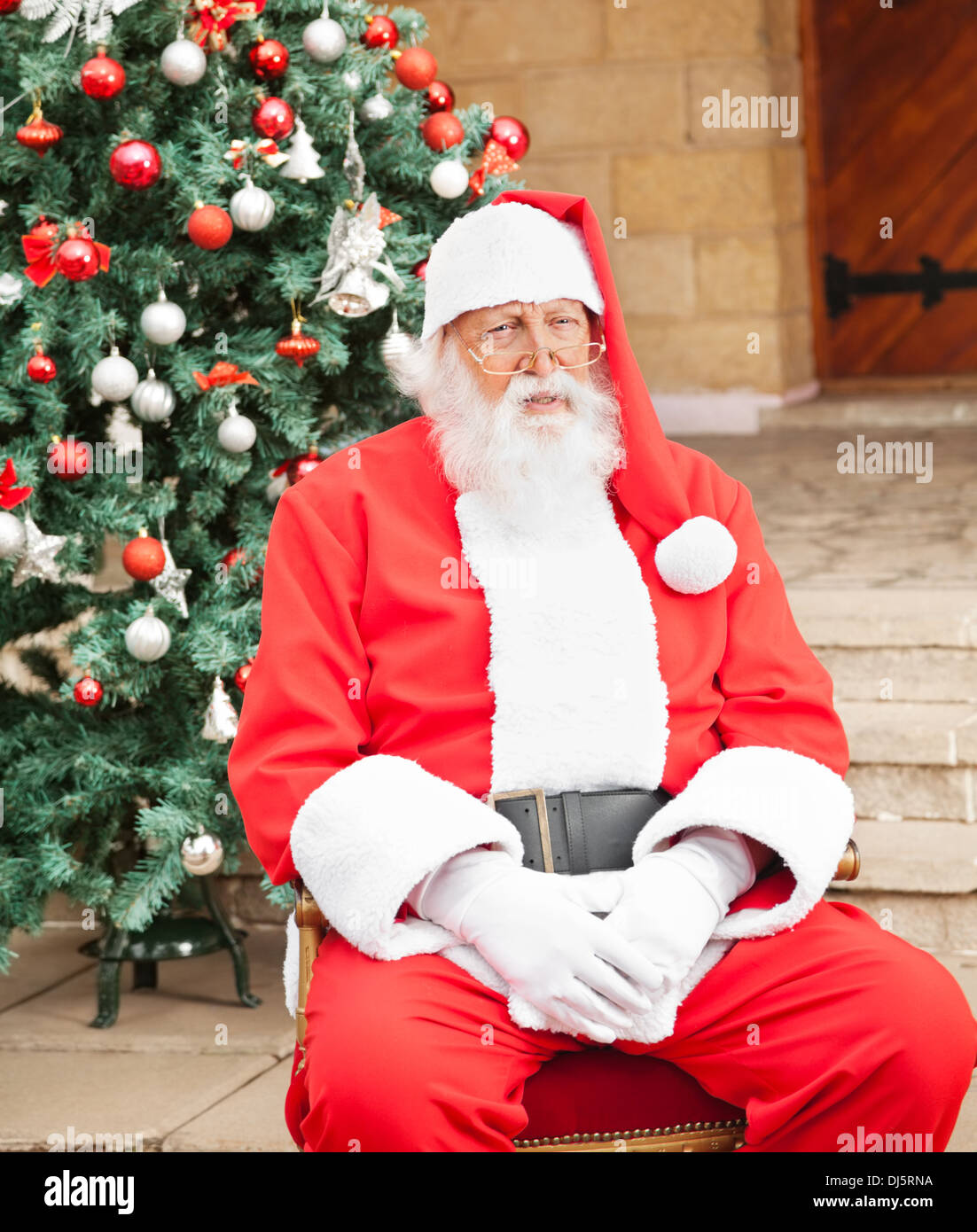 Man Dressed As Santa Claus Sitting In Front Of House Stock Photo - Alamy
