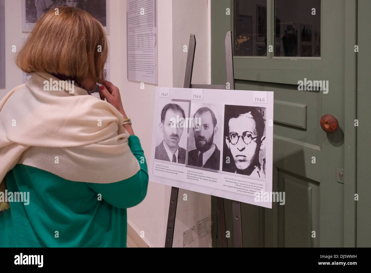 A woman view old photographs of former Israeli prime minister Menachem Begin in a gallery in West Jerusalem Israel Stock Photo