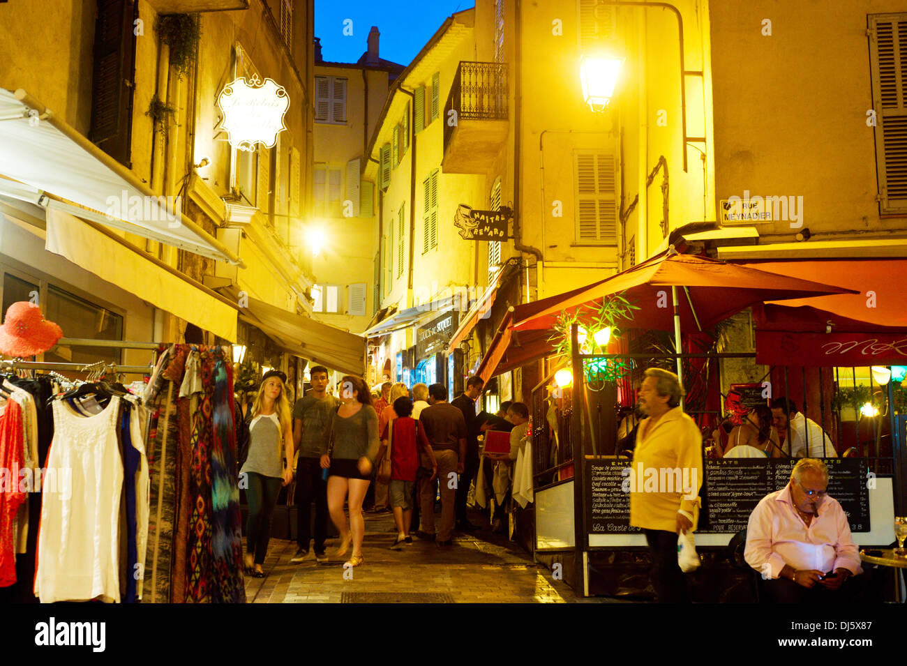 Tourists visit local shops in Cannes old city center. Stock Photo
