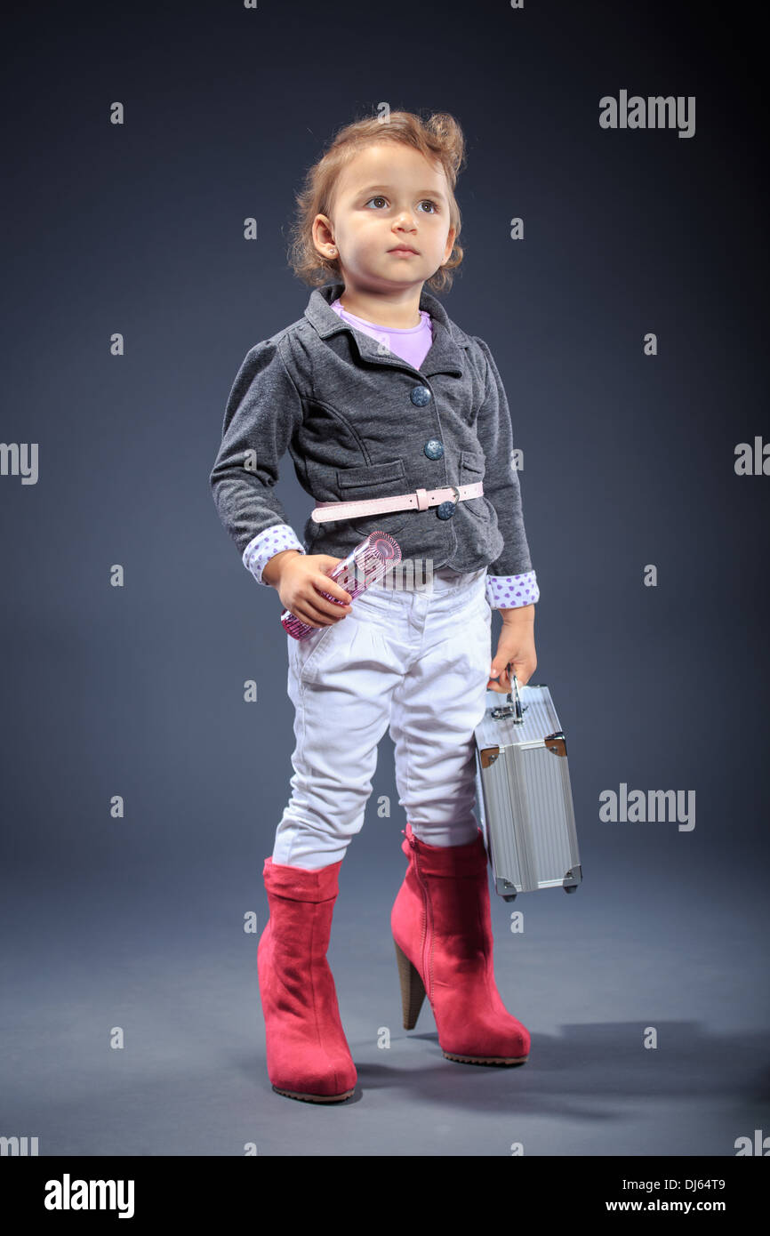 studio shot of a little dressed up girl Stock Photo