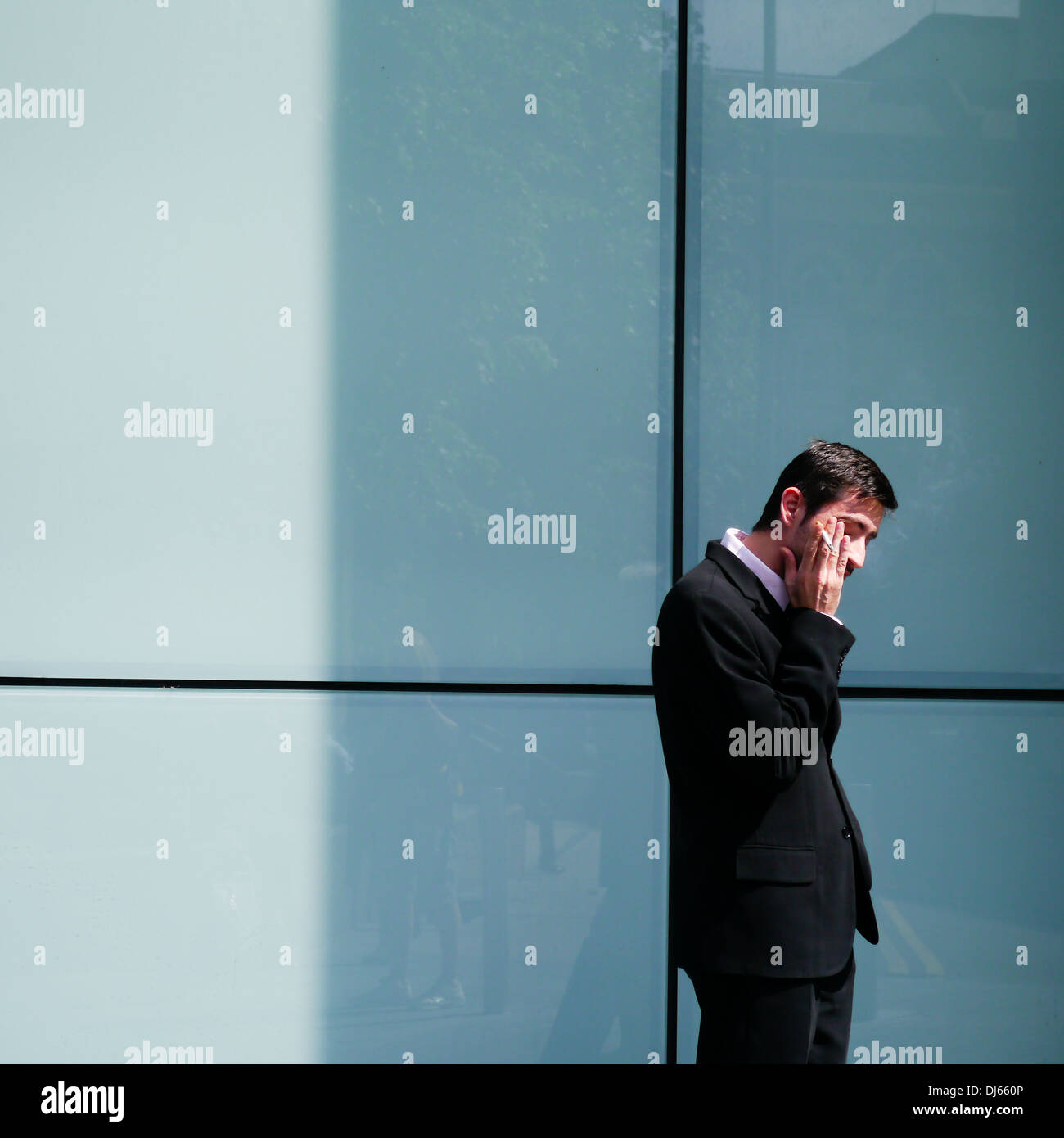 An office worker takes a break, City of London, Southbank, London Stock Photo
