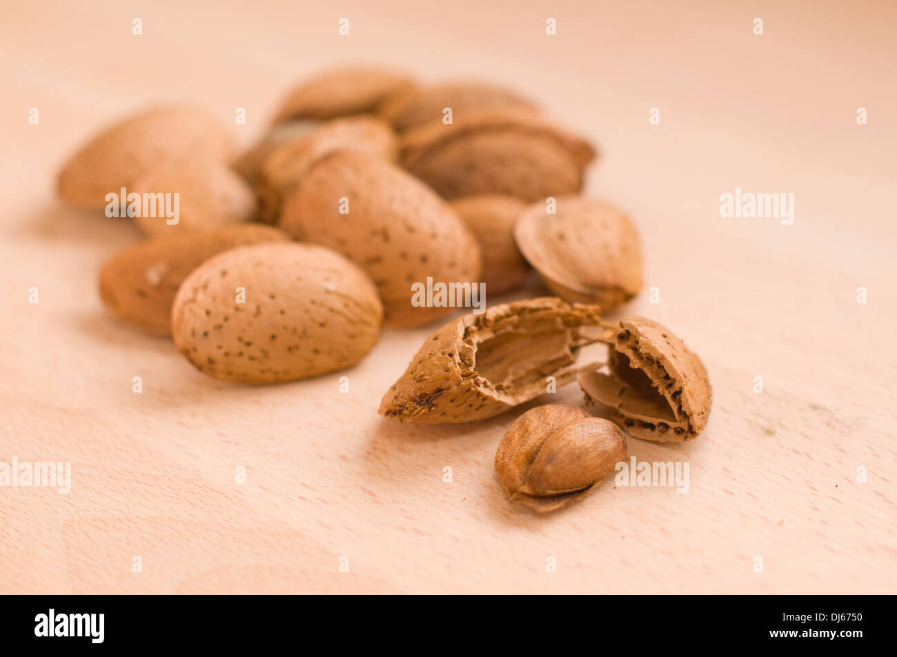 Group of almonds and one of them out of it shell Stock Photo