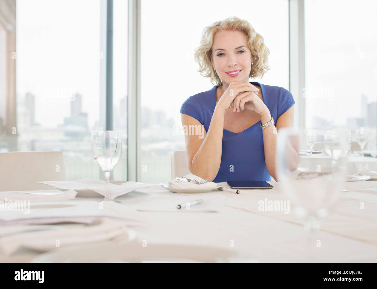 Businesswoman sitting in restaurant Stock Photo