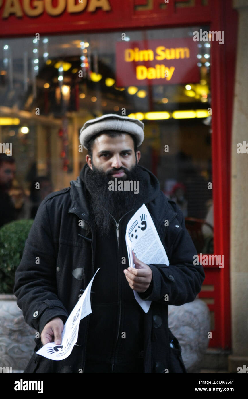 London, UK. 22nd November 2013. Activist hands out leaflets at Anjem Choudary Islamic Roadshow protest to stop the Chinese oppression Against the Muslims of Xinjiang, Gerrard Street, London, UK, 22 November 2013 Credit:  martyn wheatley/Alamy Live News Stock Photo