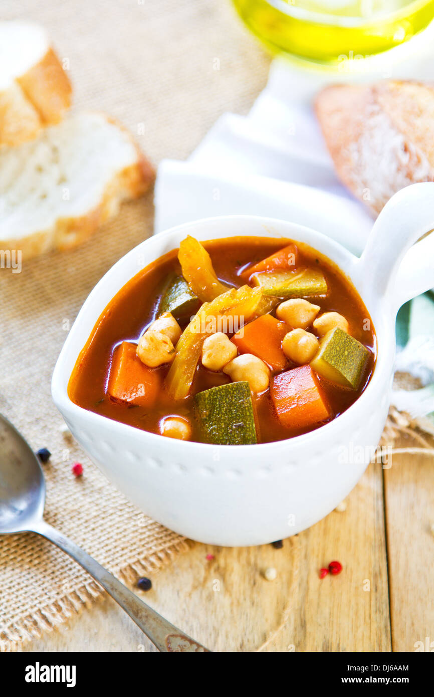 Vegetables with Chickpea soup by loaf of bread Stock Photo Alamy