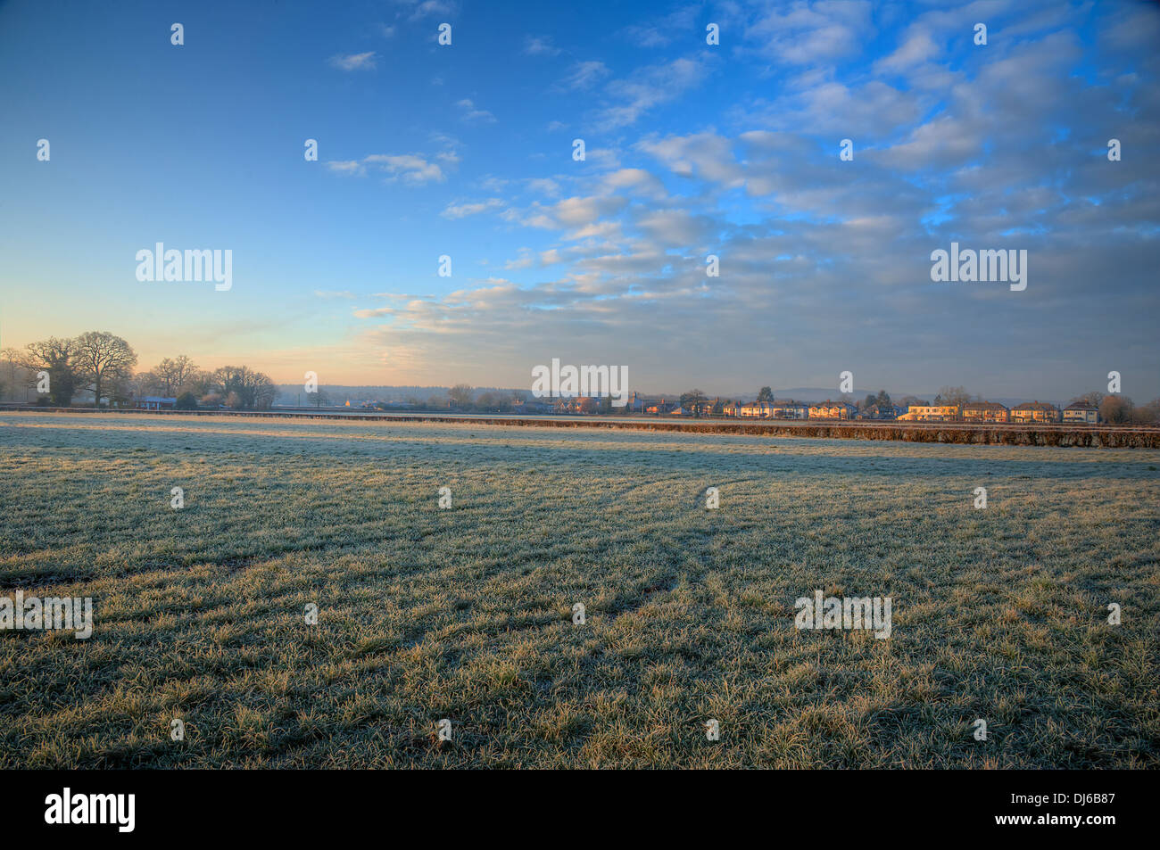 A cold winter sunrise morning with frost in the English countryside ...