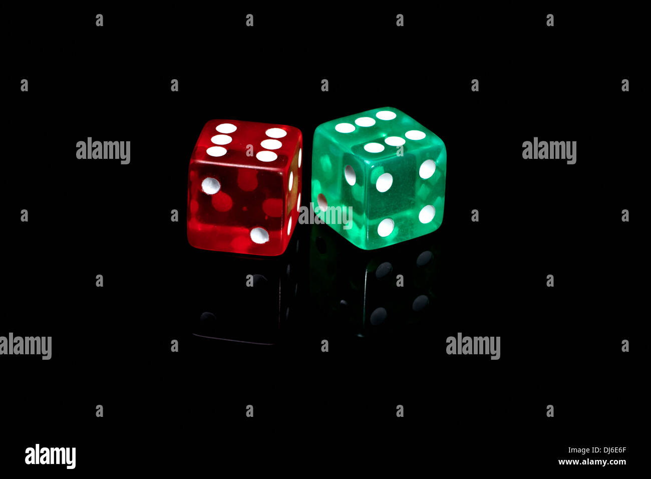 Two colour casino dice on a black background Stock Photo