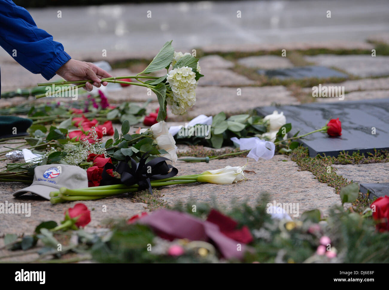 (131122) -- WASHINGTON D.C., Nov. 22, 2013 (Xinhua) -- A person places flower at the gravesite of former U.S. President John F. Kennedy at Arlington National Cemetery in Virginia, the United States, Nov. 22, 2013. Kennedy was fatally shot while riding in an open car in a motorcade during a visit to Dallas on Nov. 22, 1963. Commemoration services are held across the country on Friday to mark the 50th anniversary of Kennedy's assassination. (Xinhua/Zhang Jun) Credit:  Xinhua/Alamy Live News Stock Photo