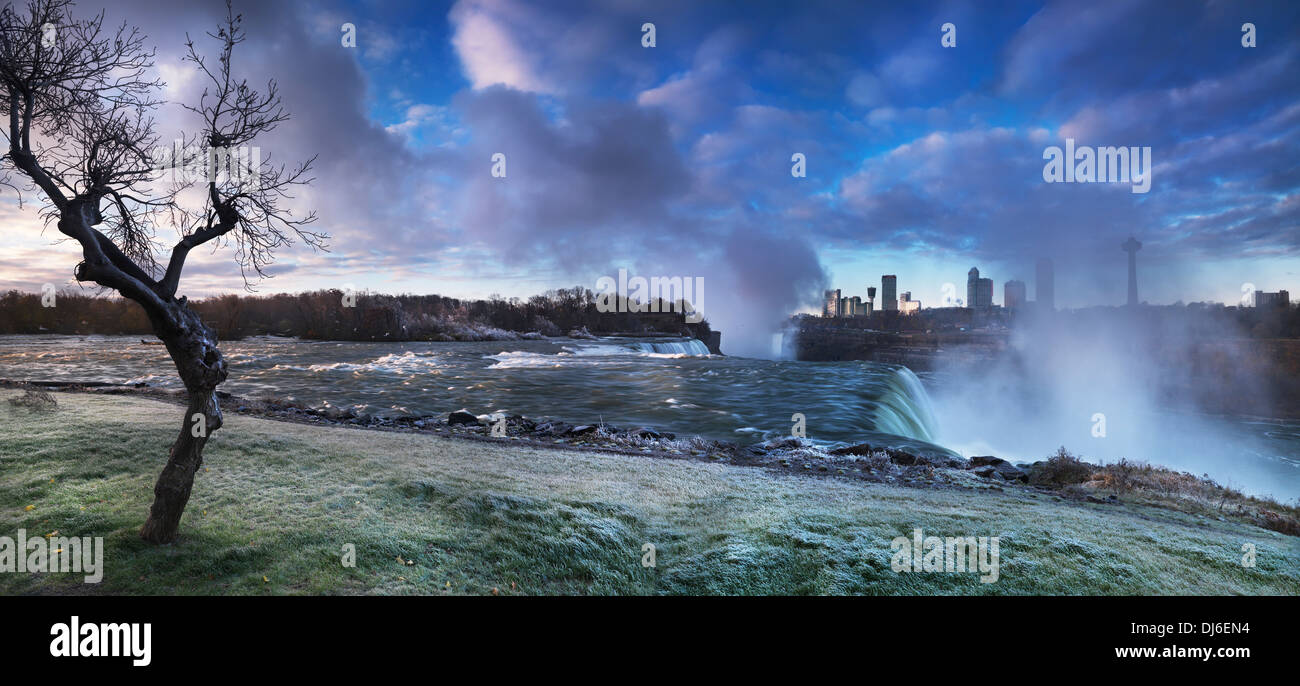 Niagara Falls sunrise with autumn morning frost covering the grass and the tree. Artistic dramatic panoramic scenery. Stock Photo