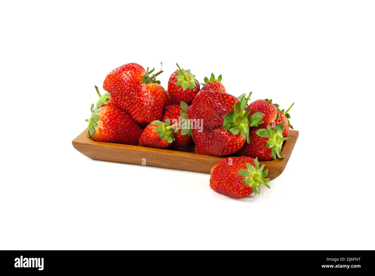 Strawberries in a wooden plate isolated on white background Stock Photo ...