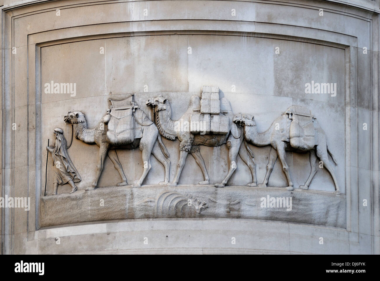 London, England, UK. Camel train relief above the entrance to HSBC bank. Former site of tea and coffee importer Stock Photo