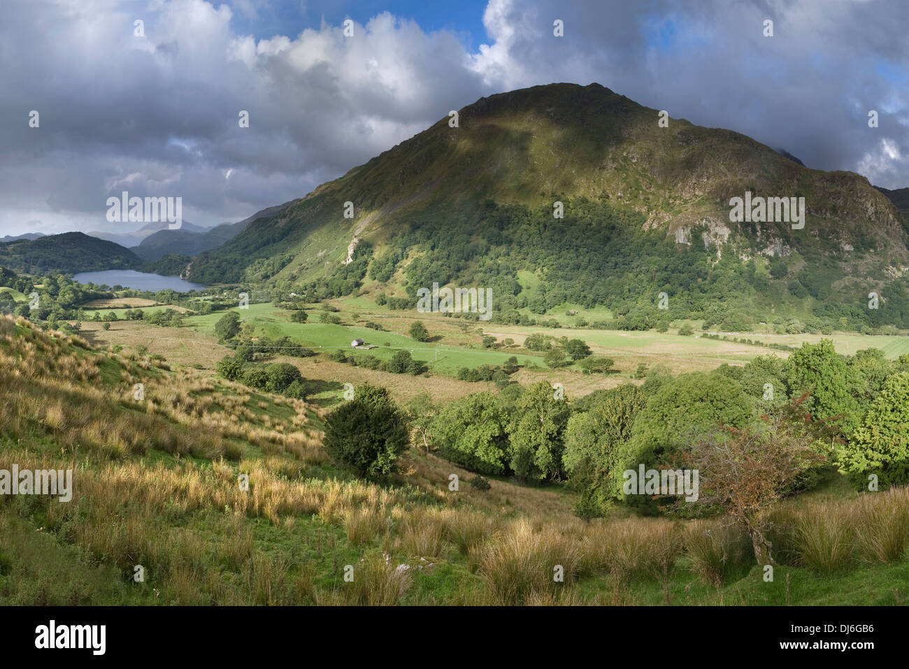 The clouds cast shadows over Gallt y Wenallt and Nant Gwynant towards Llyn Gwynant. Stock Photo