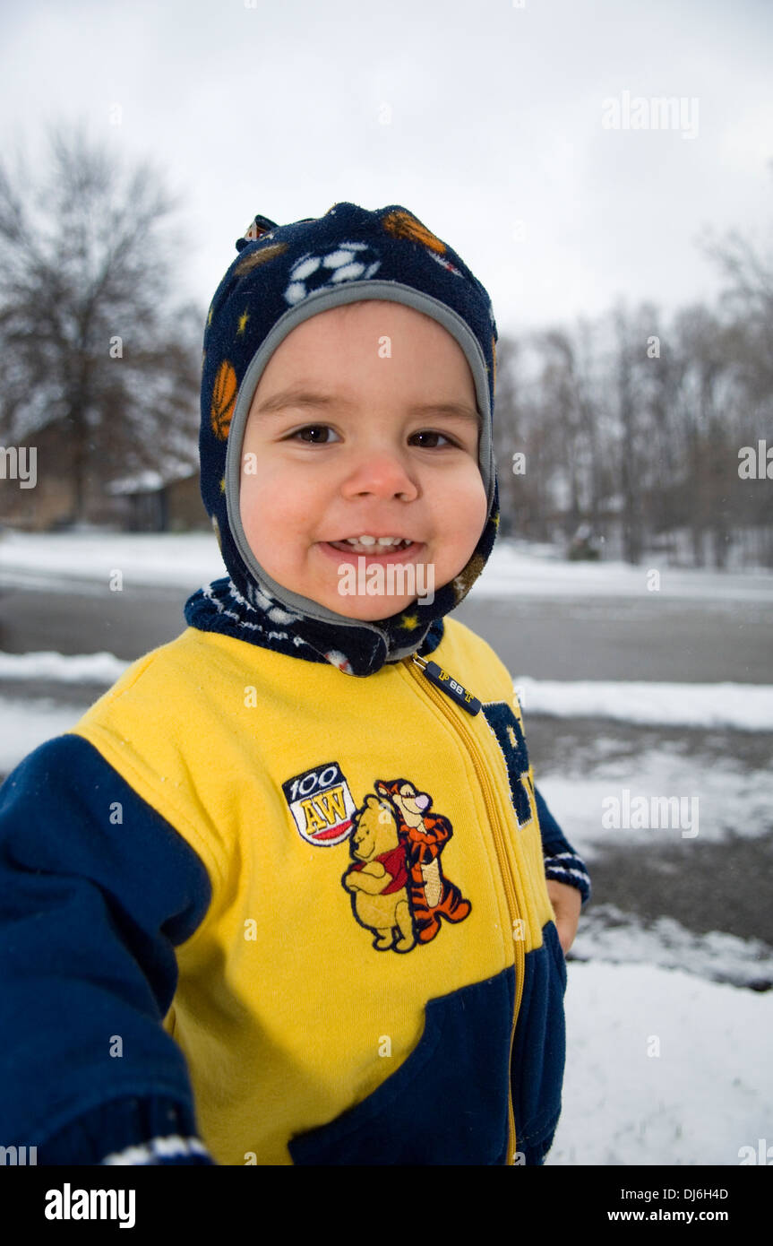 One and a Half Year Old Boy Outside on Snowy Day Stock Photo