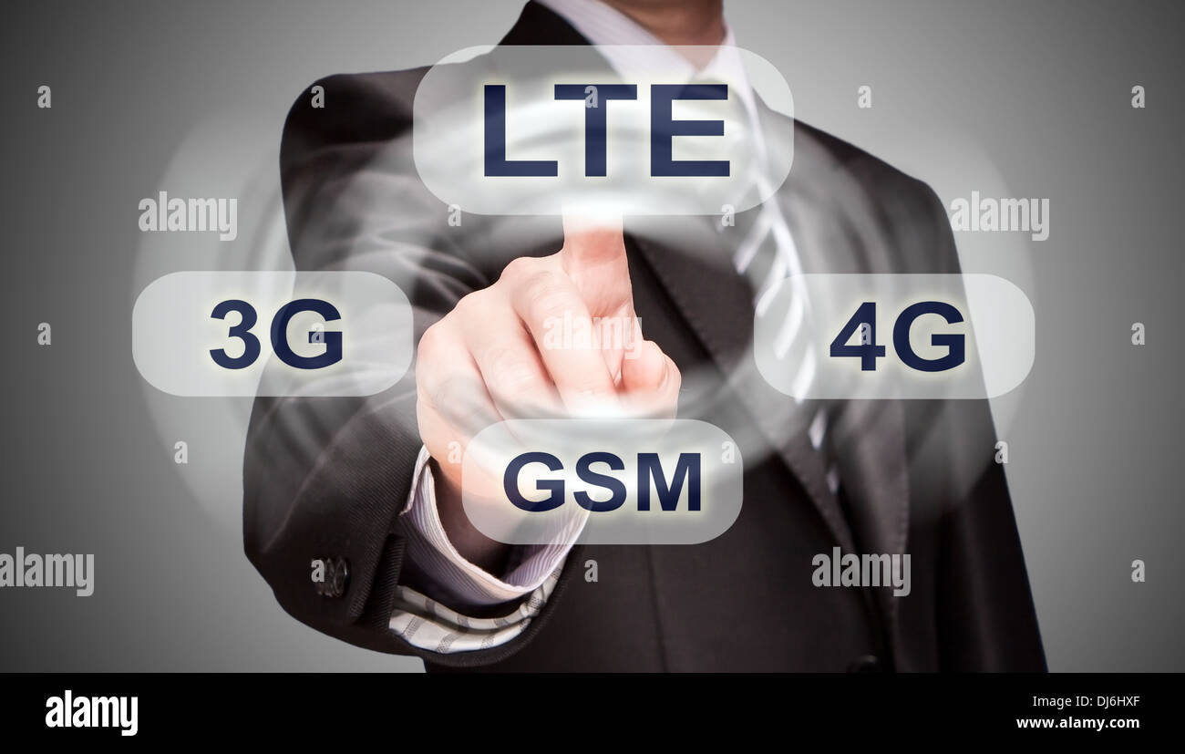 businessman is pushing his finger on lte button Stock Photo