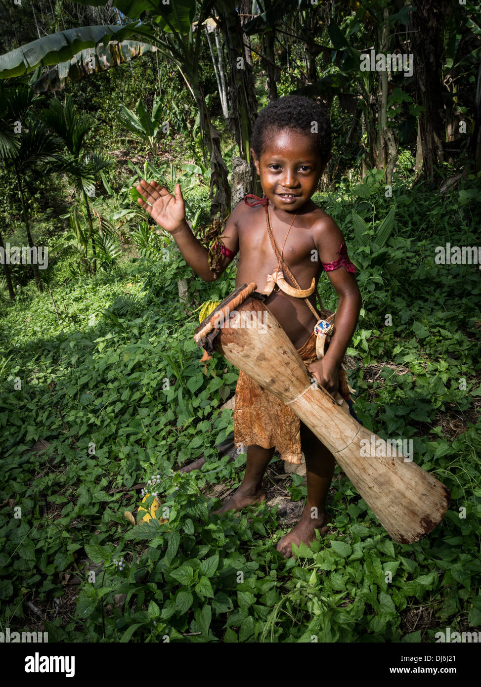 Papua New Guinea boy with kundu drum from Hobe Village, Madang, Papua New Guinea Stock Photo