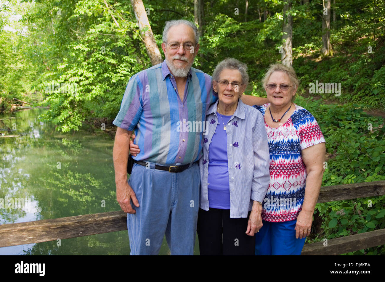 Nonagenarian Woman Posing with her Son and Daughter Stock Photo
