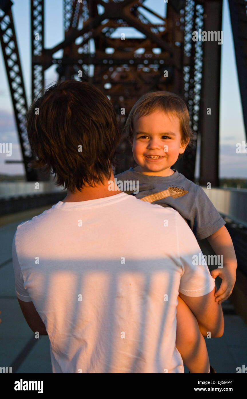 Father Carrying Two Year Old Son on the Big Four Pedestrian Bridge in Louisville, Kentucky Stock Photo