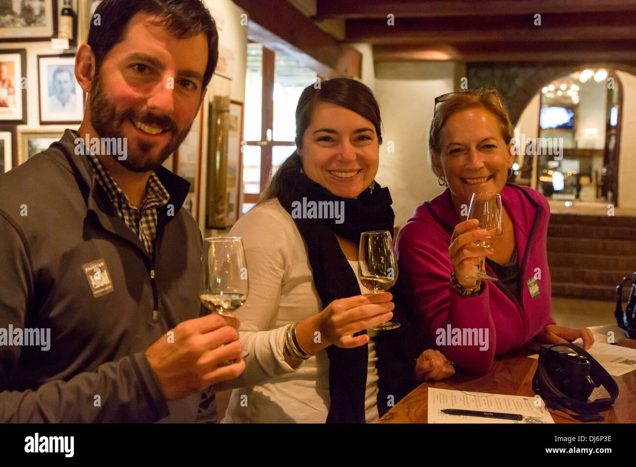 South Africa, Paarl area, near Cape Town. Tourists enjoying a wine-tasting session at Fairview winery. MR. Stock Photo