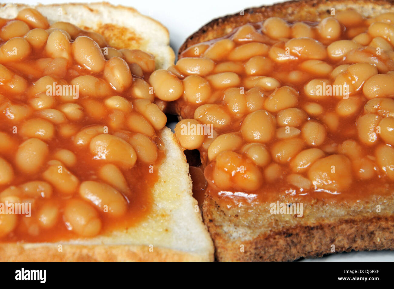 Two rounds of baked beans on toast. Stock Photo