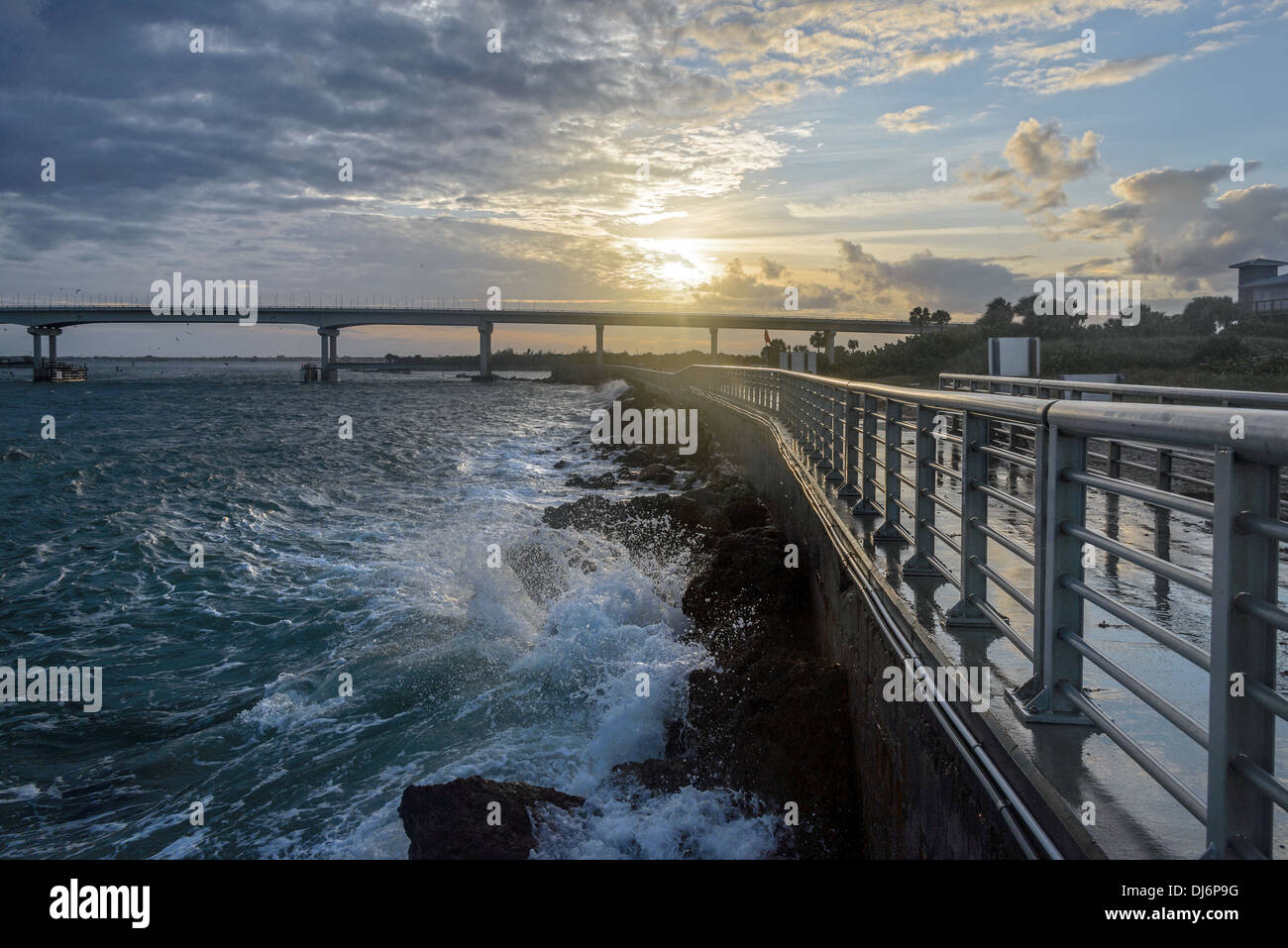 The sun breaks out of the storm clouds after a heavy rain at the Sebastian Inlet in Florida. Stock Photo