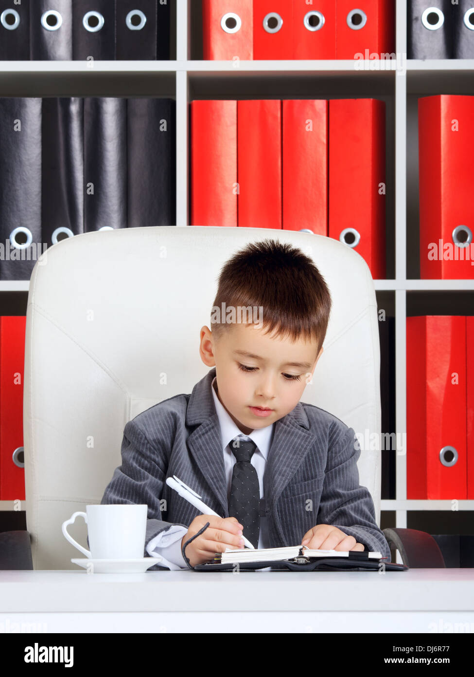 little boy as a businessman, in office Stock Photo