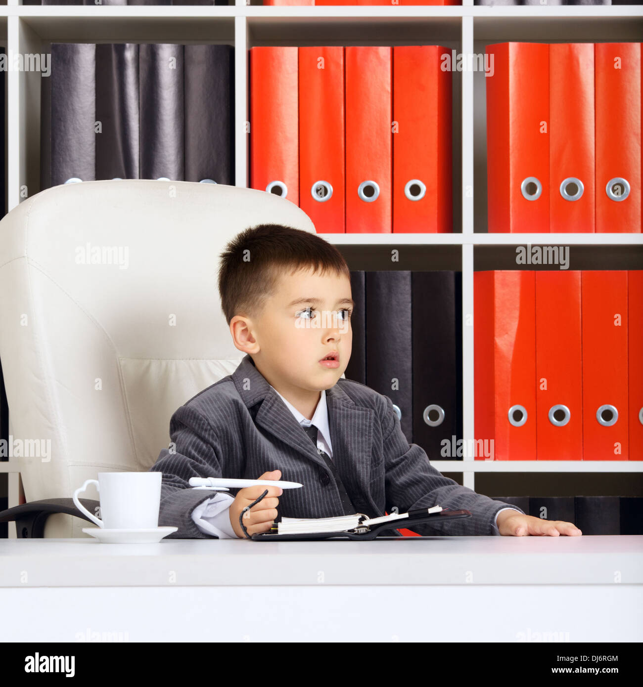 little boy as a businessman, in office Stock Photo
