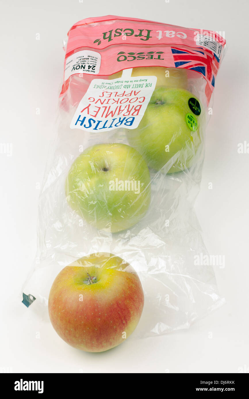 Bag of four eat fresh British Bramley cooking apples from Tesco Stock Photo