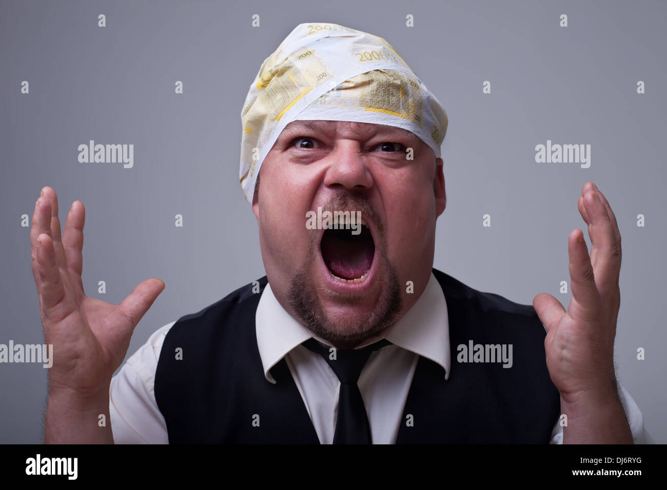 Businessman having financial problems - with euro banknotes bandage on head Stock Photo