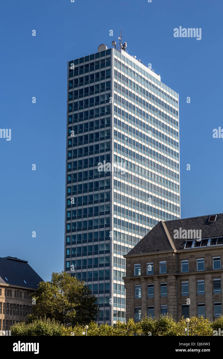 shoot of an office building and old buildings in front, with blue sky ...