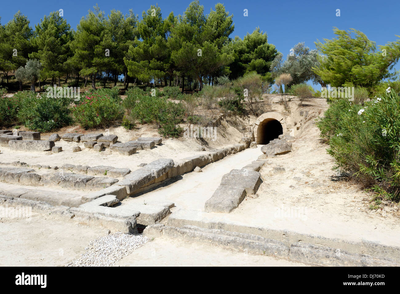 Arched limestone vaulted competitors entrance tunnel to the ancient stadium at Nemea Peloponnese Greece. Built in 320 BC, the tu Stock Photo