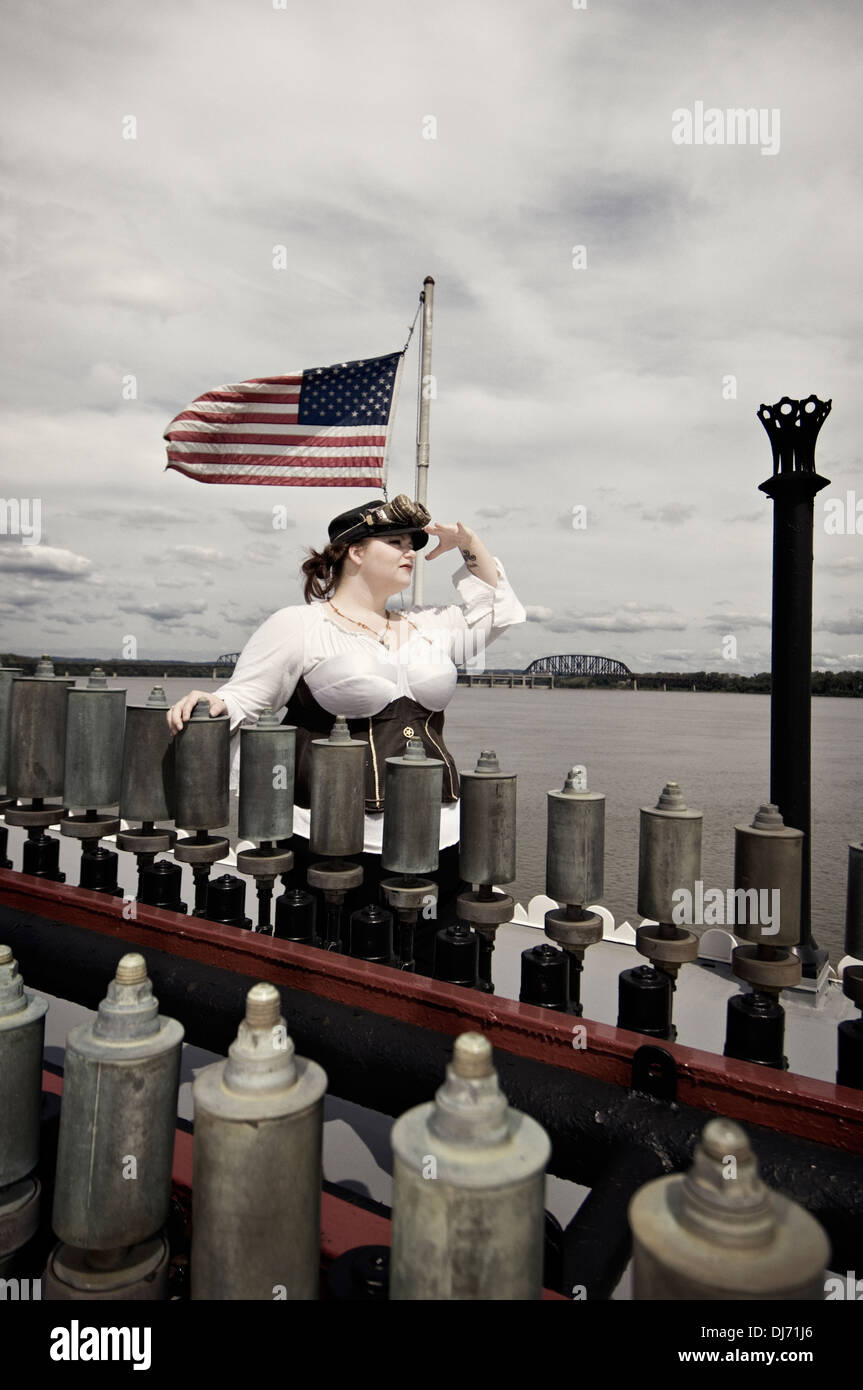 Young Woman Dressed in Steampunk Posing Behind Calliope Whistles on the