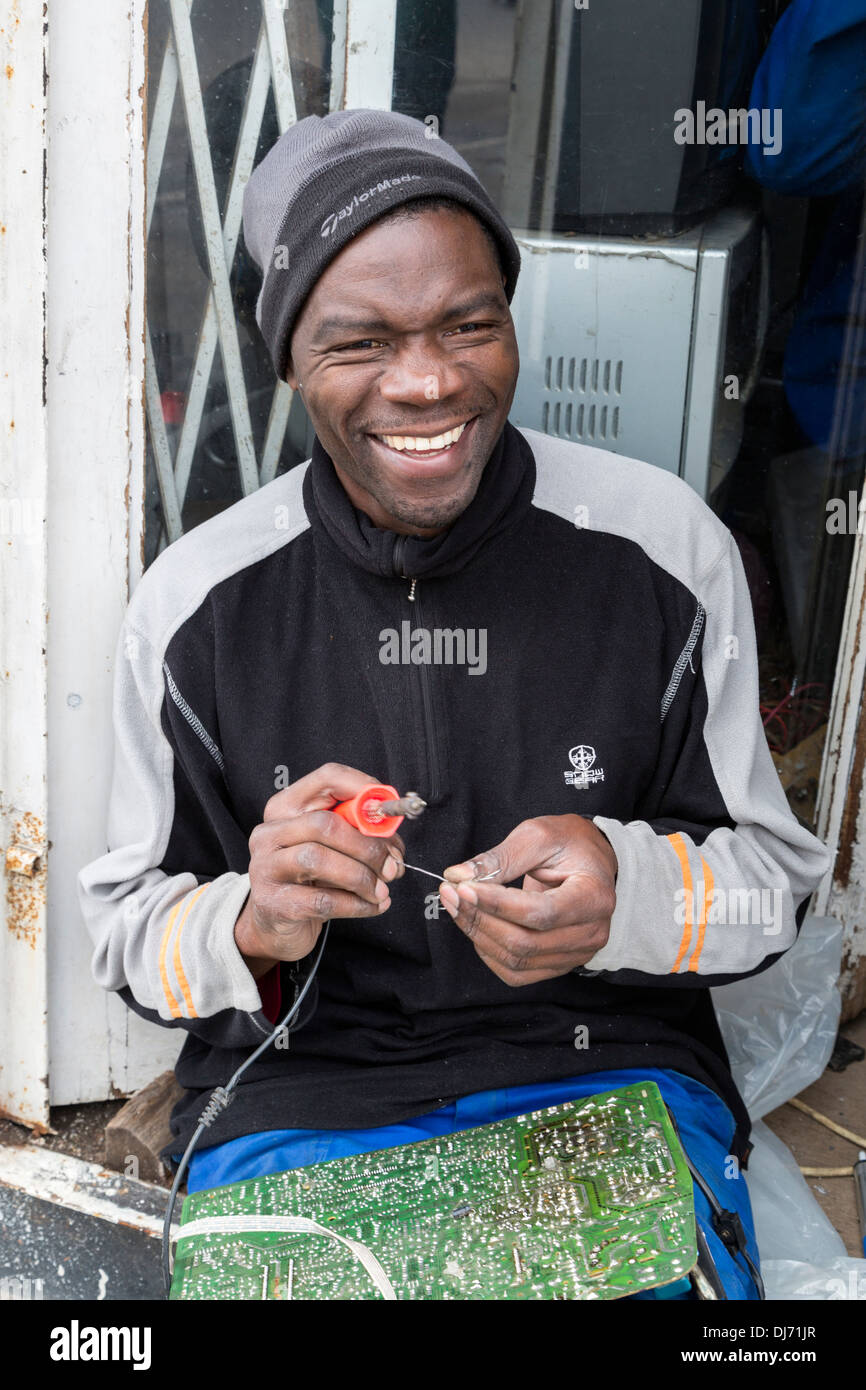 South Africa, Cape Town, Guguletu Township. South African Working on an