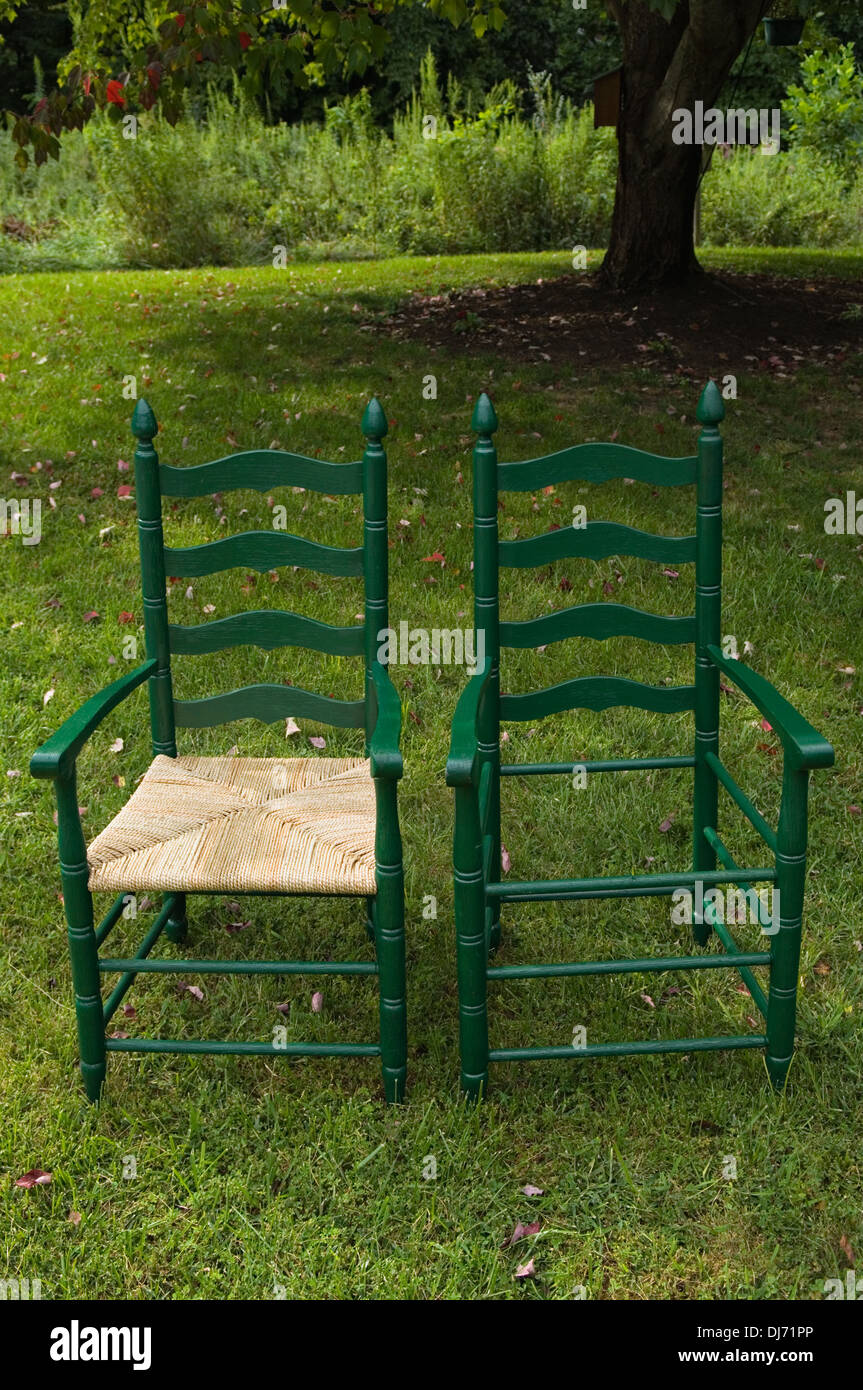 Hand-painted decoration on double doors in traditional with rush-seated  ladder-back chair and terracotta tiled floor Stock Photo - Alamy