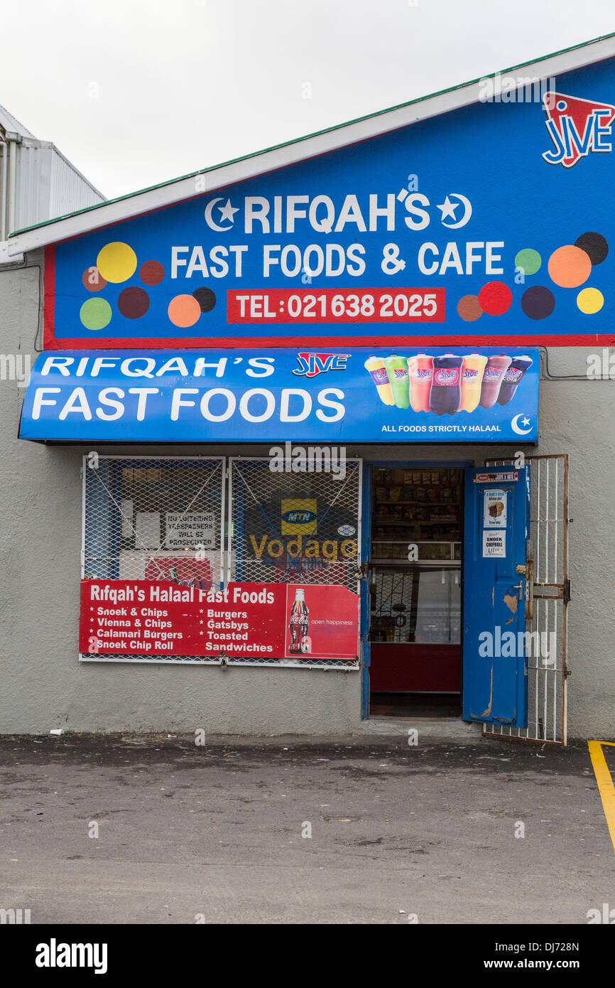 South Africa, Cape Town. Fast Food Store Offering Halaal (Islamic-approved) Food and Snacks. Note Metal Security Gates. Stock Photo