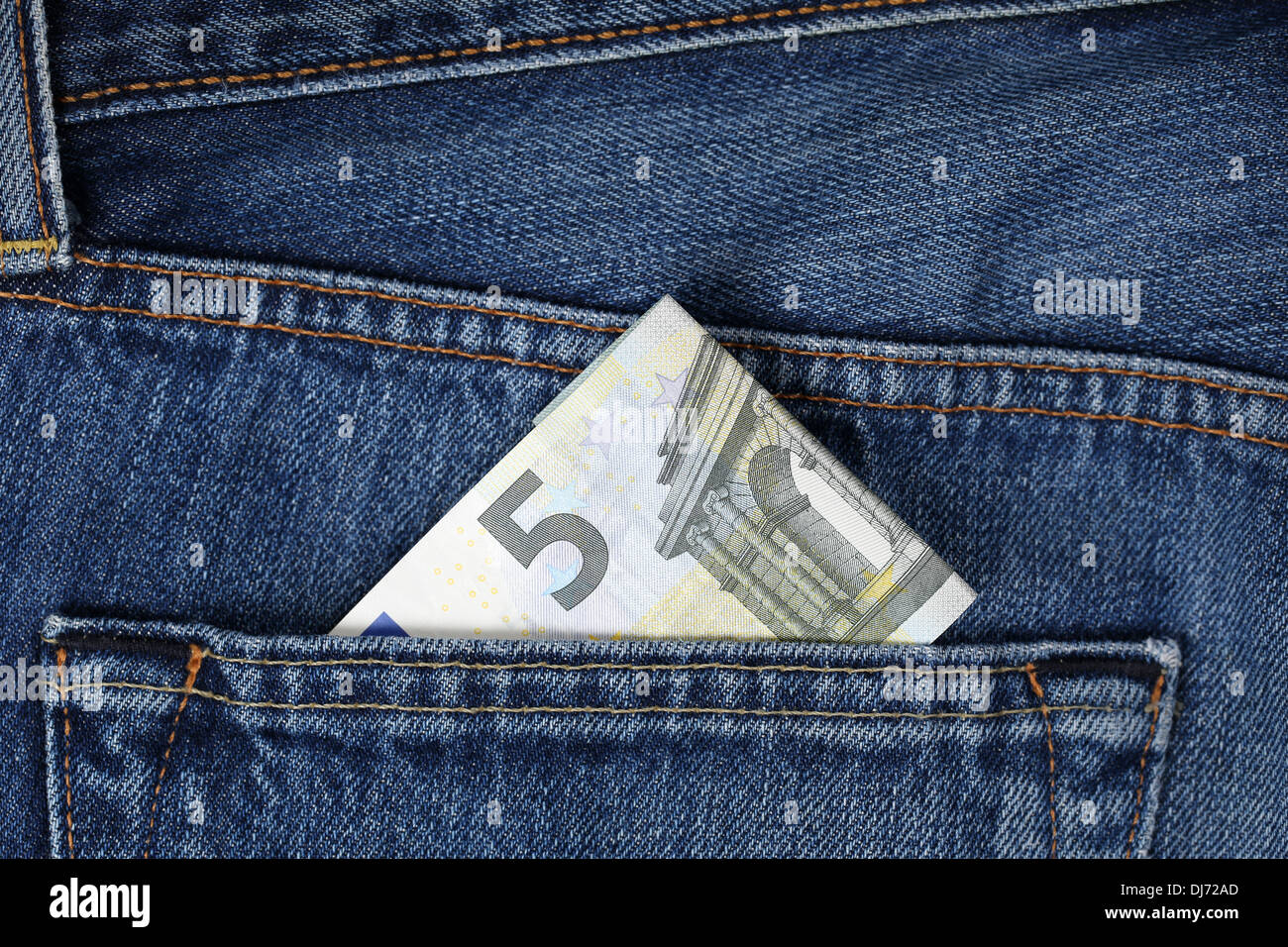A 5 Euro banknote in a trouser pocket Stock Photo - Alamy