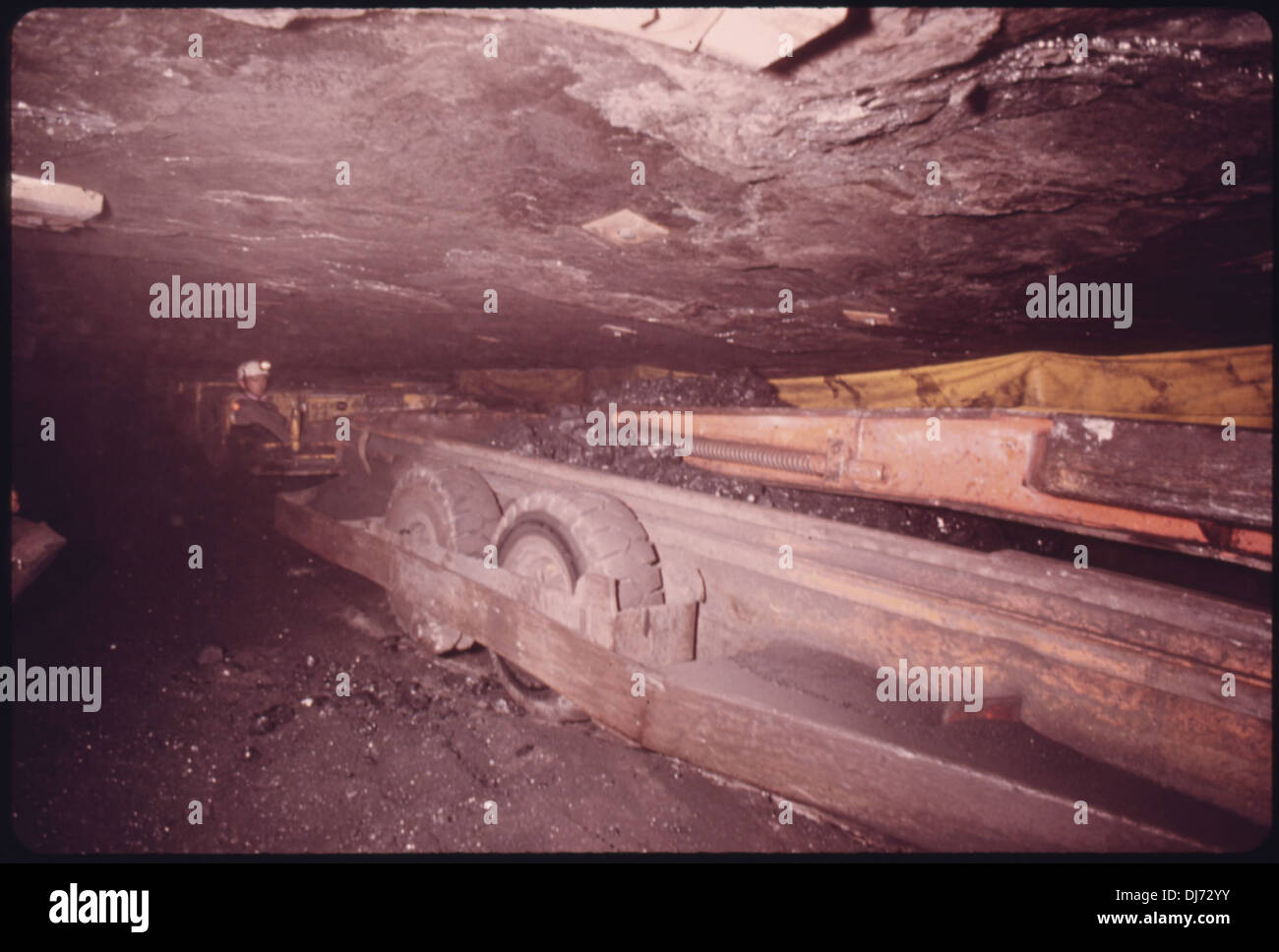 SHUTTLE CAR OF COAL IN A THREE FOOT SHAFT IN A MINE OWNED BY THE ...