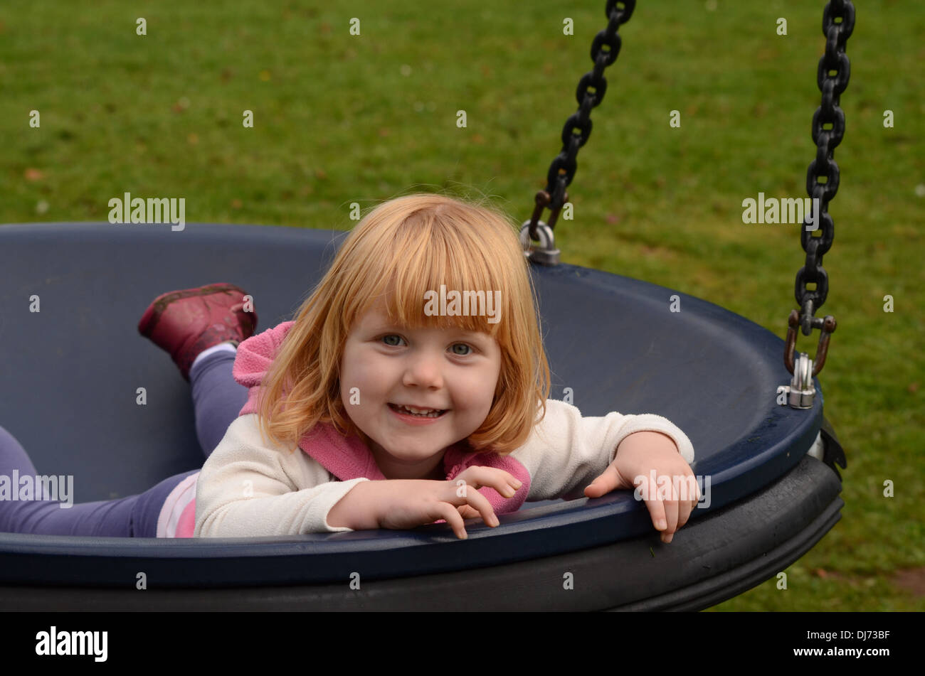 3 year old girl on a swing Stock Photo