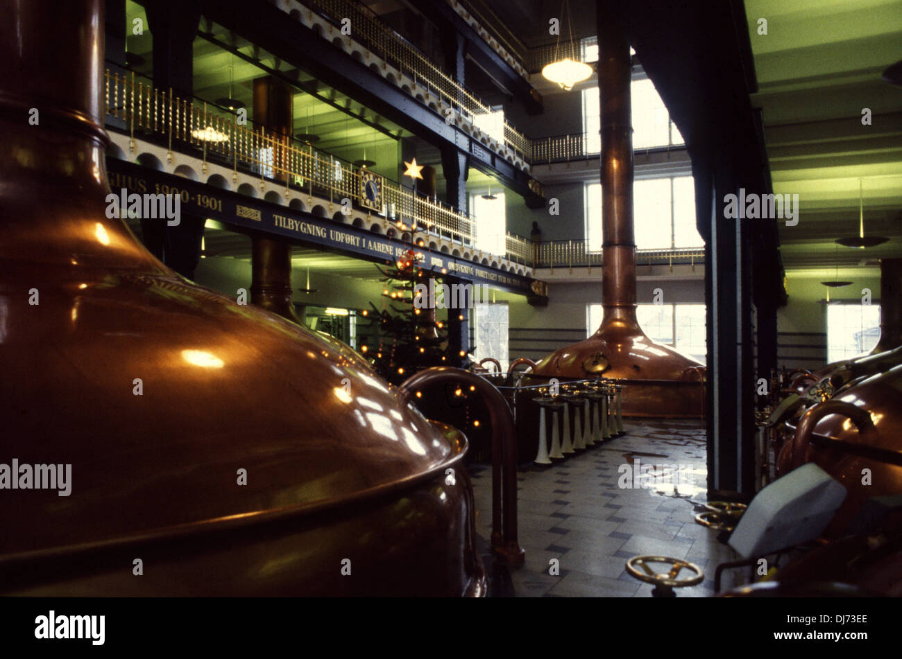 The old shining copper beer kettles inside Carlsberg brewhouse visitor