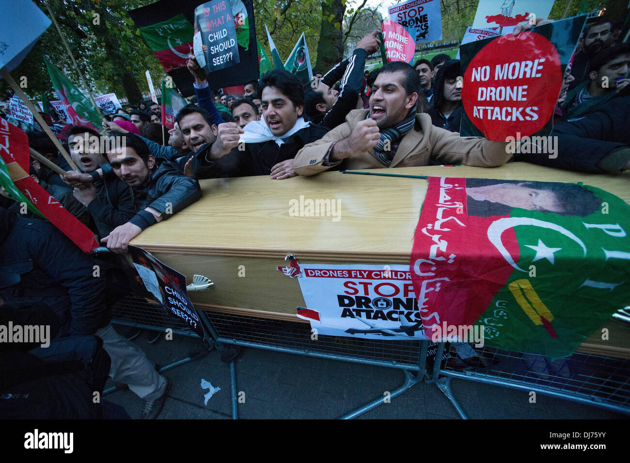 London, UK, UK. 23rd Nov, 2013. Members and supporters of Pakistan Tehreek-e-Insaf march from 10 Downing street to the US embassy in London demanding an end to the use of US drone strikes in Pakistan. Credit:  Gail Orenstein/ZUMAPRESS.com/Alamy Live News Stock Photo