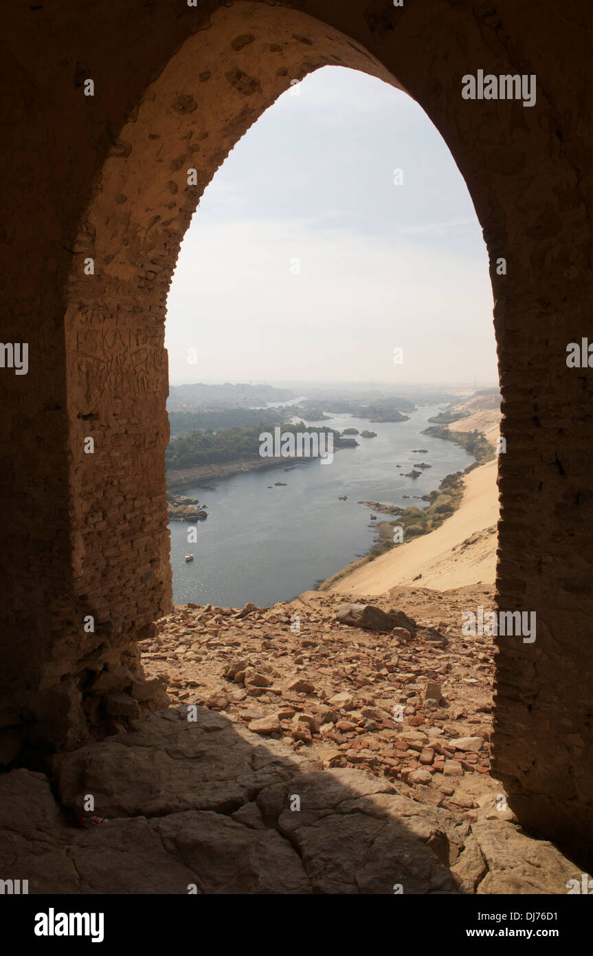 View of the Nile from within Qubbet all Hawa atop a desert ridge on the east bank of the Nile at Aswan, Egypt. Stock Photo